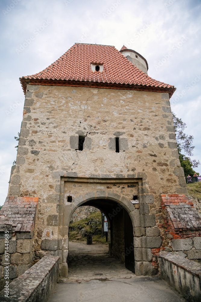 Medieval gothic castle Zvikov or Klingenberg on a rock above the confluence of the Vltava and Otava rivers, main entry gate, South Bohemia, Czech Republic