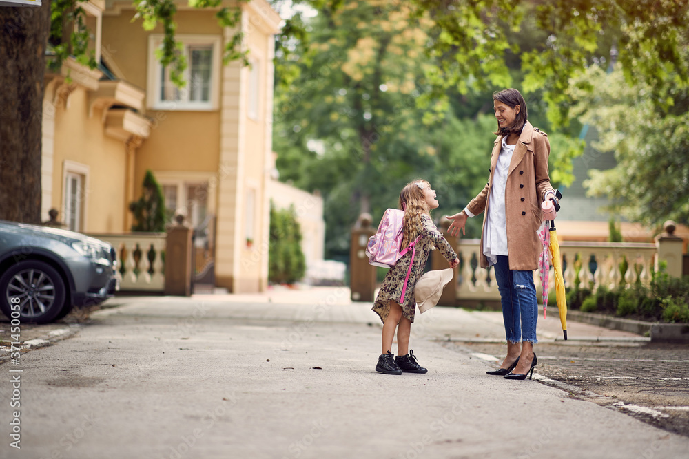 Mother and daughter ready for school Mother and daughter ready for school
