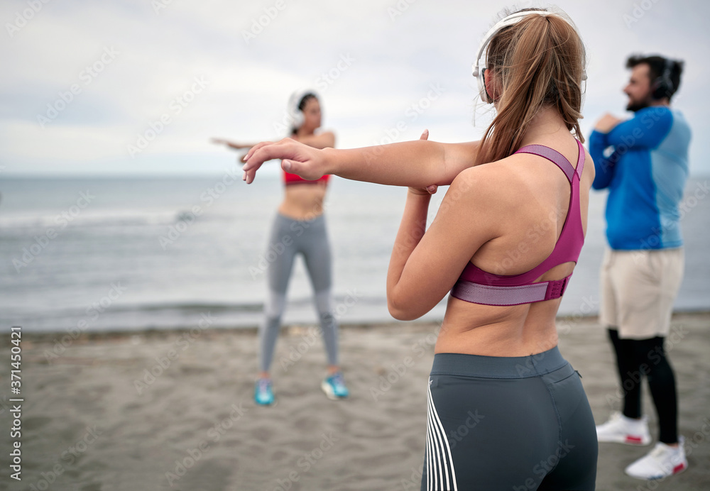 Group of people exercising together; Healthy lifestyle concept Group of people exercising together; Healthy lifestyle concept