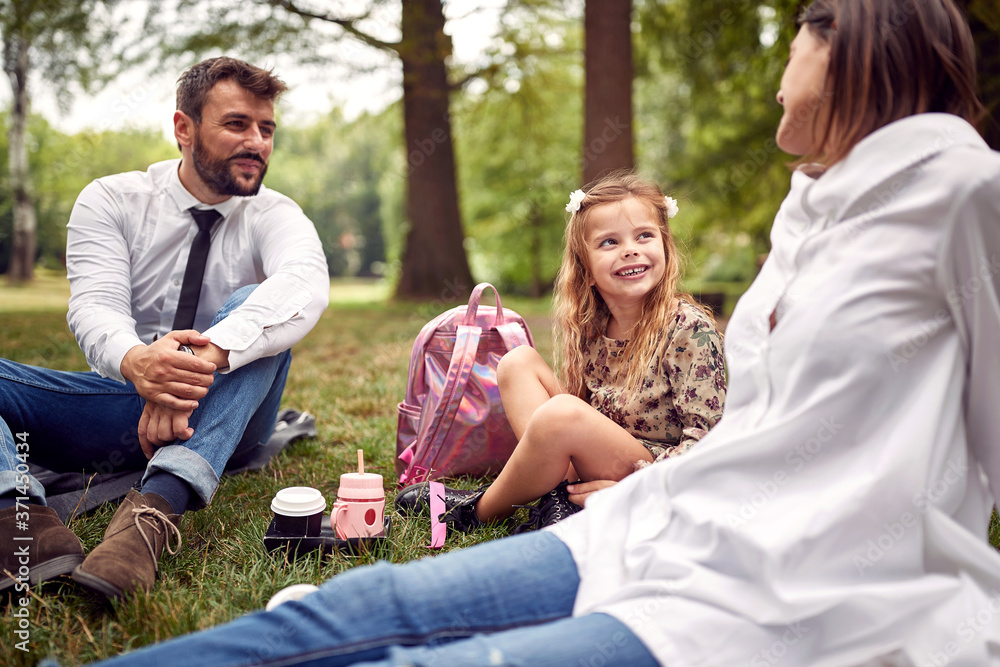 Fototapeta premium Family having a picnic after school