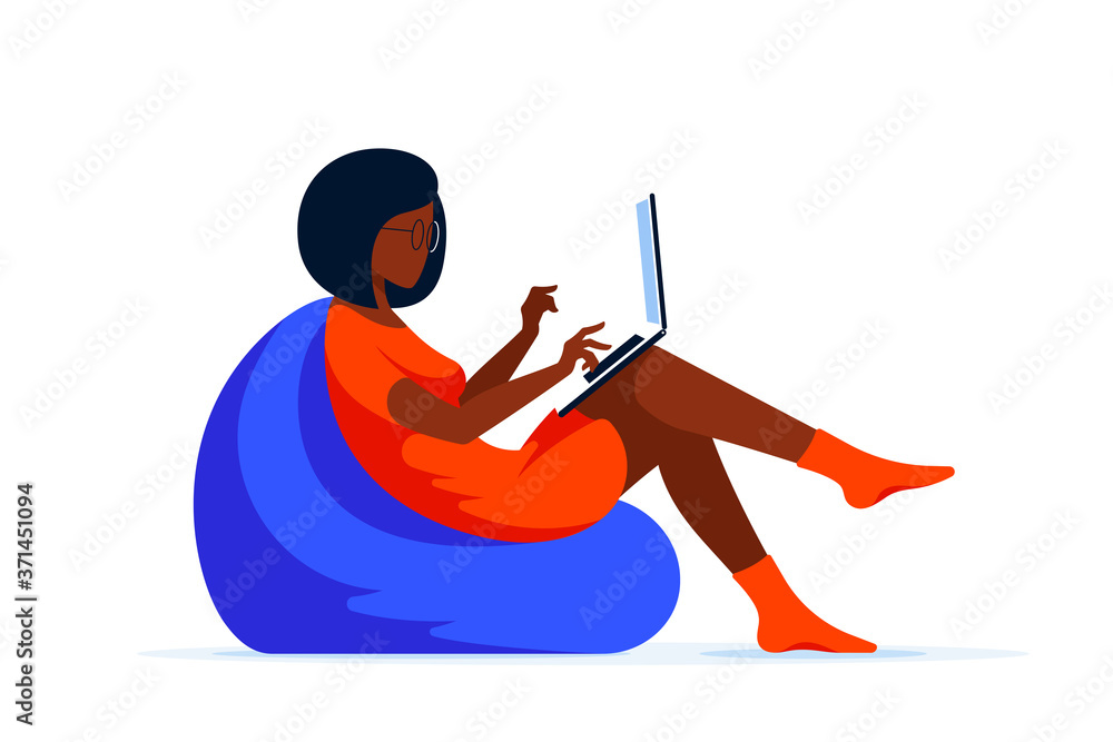 Young woman with laptop sitting in chair bag