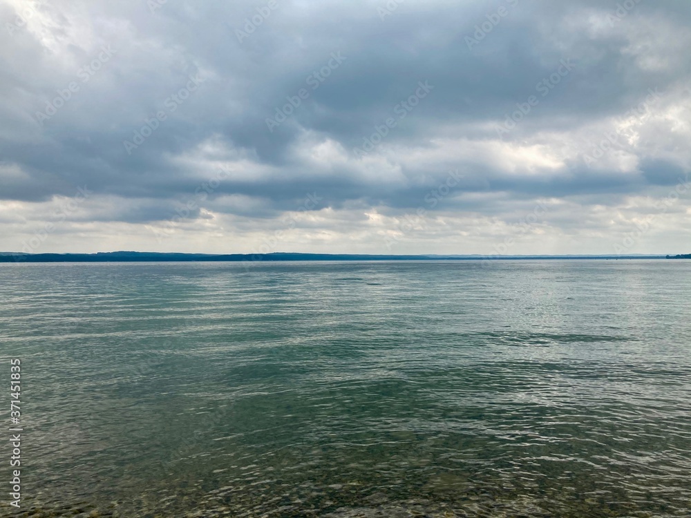 Obraz premium storm clouds over lake in summer