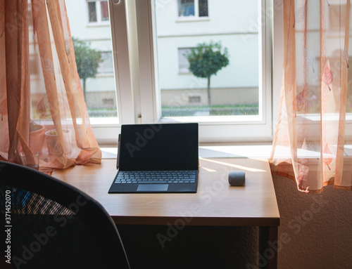Wallpaper Mural Home office working place with Laptop on a wooden desk. no person. Quarantine at home, corona virus, covid19 Torontodigital.ca