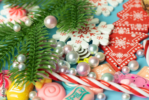 Pearls, christmas tree branch, New Year toys background. Cheerful and bright holidays design