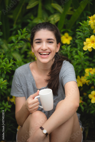 Beautiful young woman smell...