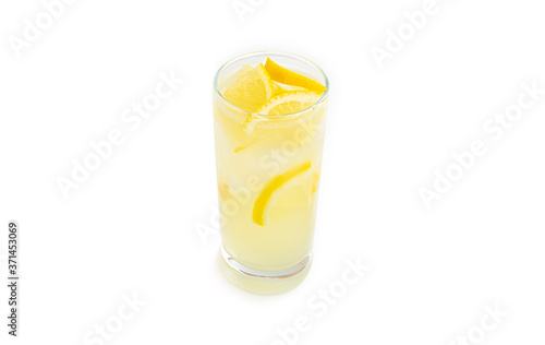 Glass with lemon lemonade and ice on a white background. . High quality photo