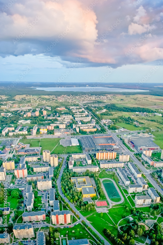 Traditional lithuanian block houses and neighborhood from aerial perspective in a city of Siauliai.