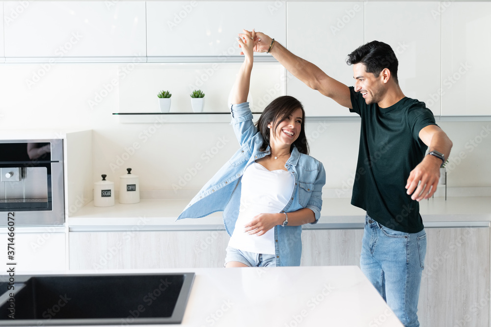 Happy Latin Couple Dancing In Kitchen Happy Latin Couple Dancing In Kitchen