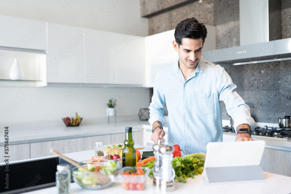 Latin Man Learning Recipe Through Internet Latin Man Learning Recipe Through Internet