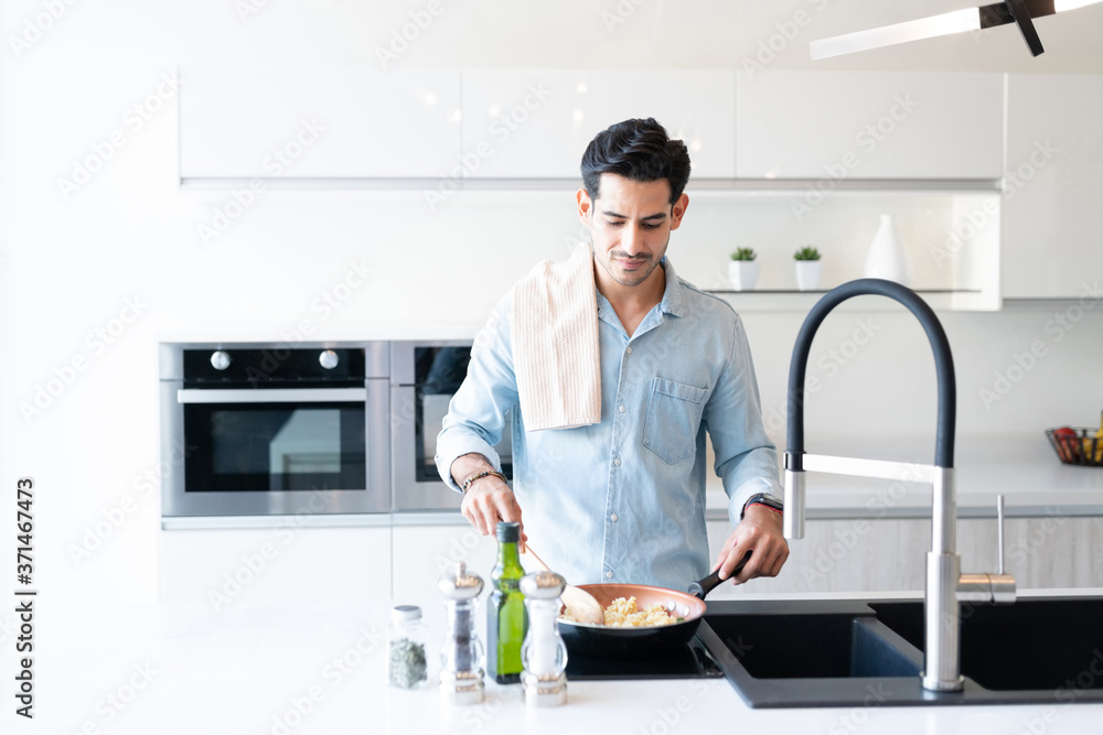 Handosme Man Preparing Food At Home Handosme Man Preparing Food At Home