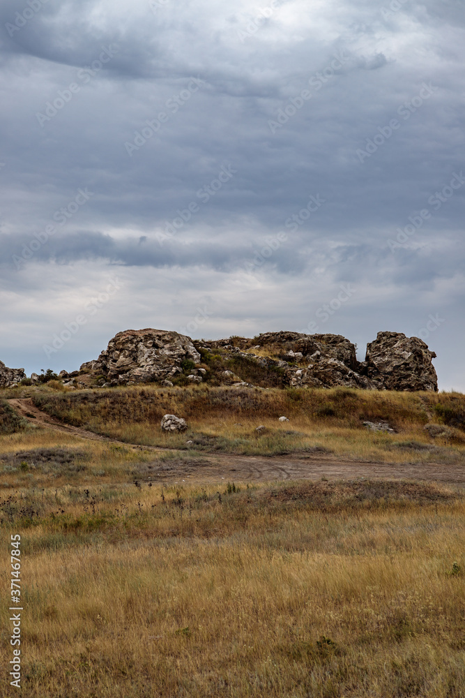 rocky steppe landscape on the background of a cloudy sky with clouds rocky steppe landscape on the background of a cloudy sky with clouds