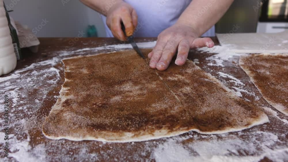 woman prepares cinnamon rolls. the concept of cooking woman prepares cinnamon rolls. the concept of cooking