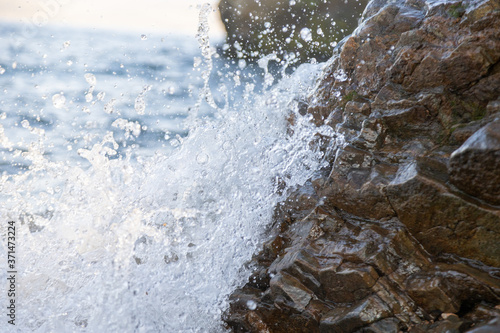 Wallpaper Mural the rocky shore of the lake in the afternoon sun with the waves Torontodigital.ca