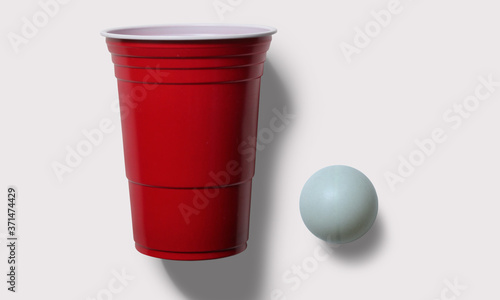 beer pong, ping pong ball and red cup on a white background