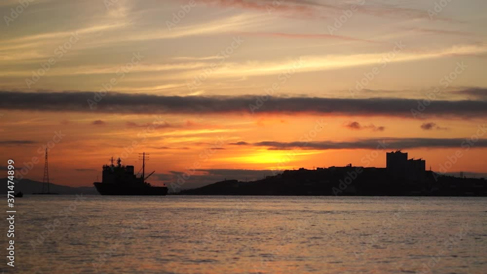 Seascape with a beautiful sunset and ships. Vladivostok, Russia