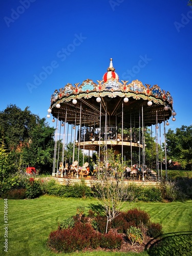 A carousel in front of a building