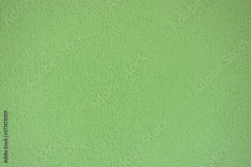 background: dark green mustard concrete wall, colored stucco background texture