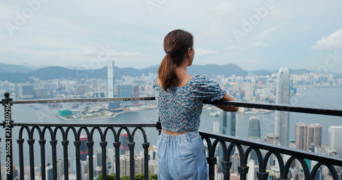 Photography Woman enjoy the city view in Hong Kong
