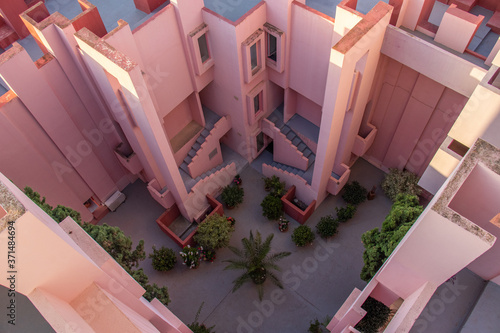 Pink courtyard with uniques stairs photo