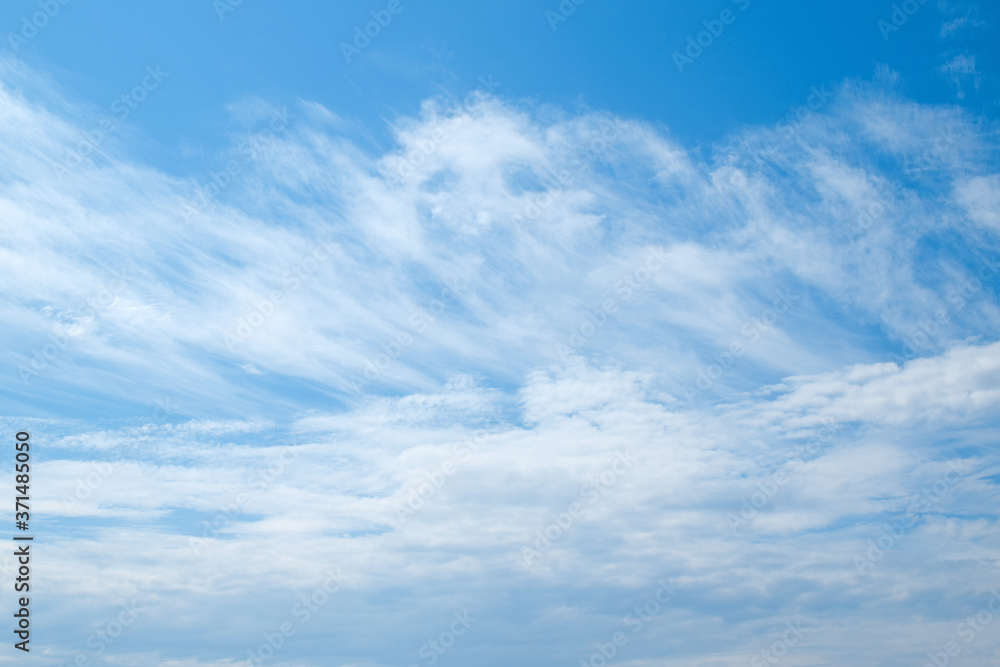 White clouds and blue sky. Blurred clouds background. White clouds and blue sky. Blurred clouds background.
