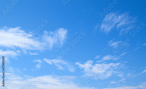 White clouds and blue sky. Blurred clouds background.