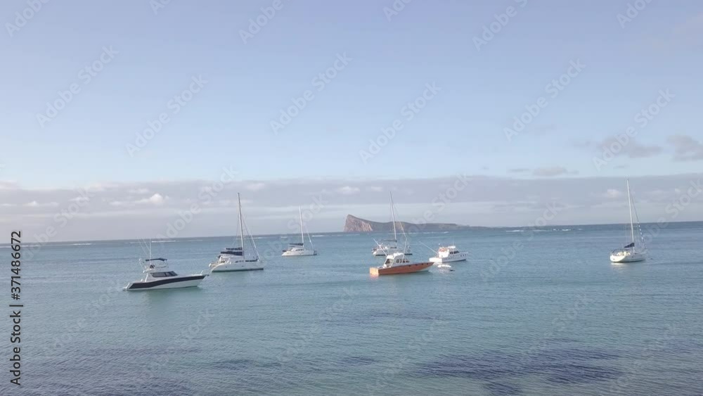 drone shot moving toward an island 