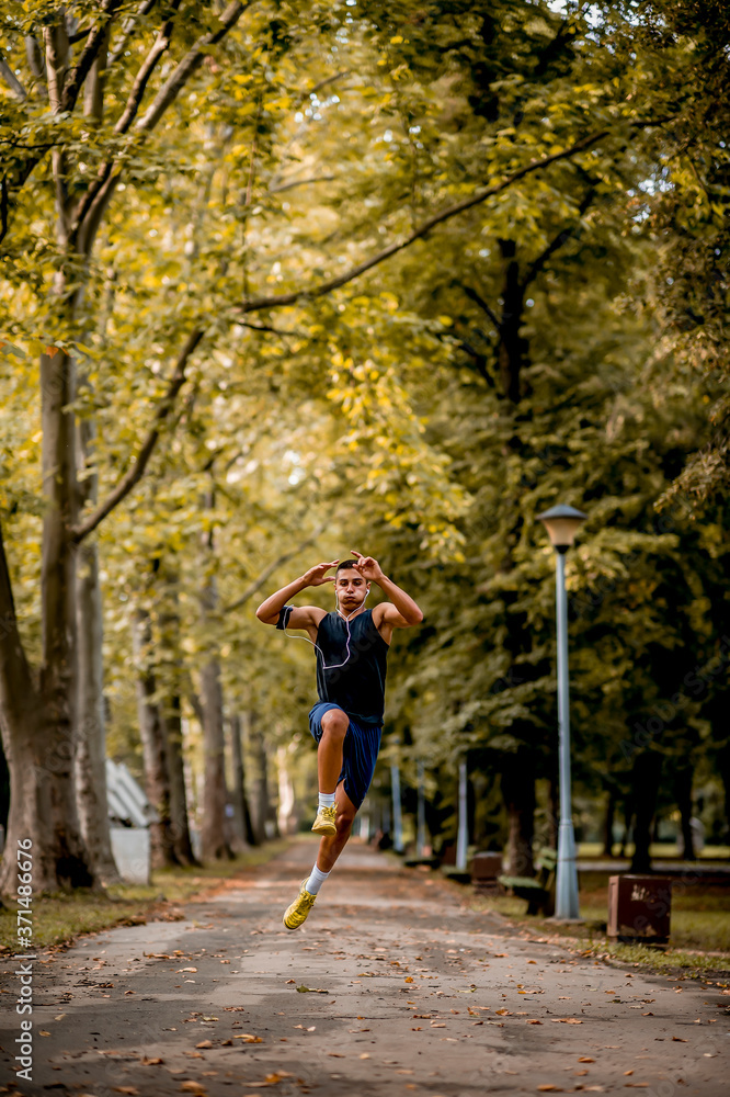 Young Caucasian man jogging in the park Young Caucasian man jogging in the park