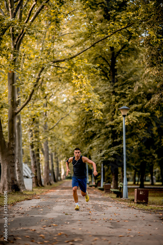 Young Caucasian man jogging in the park