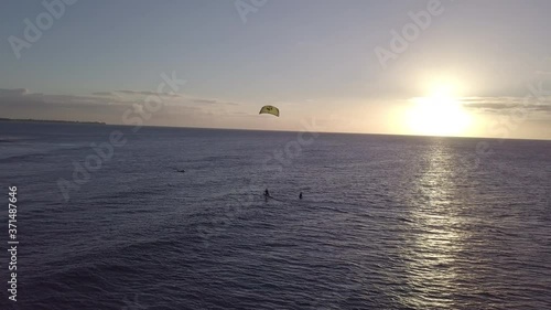 drone shot of a kitesurfer during sunset
