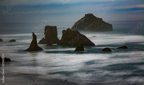 Face Rock and other sea Stacks at Bandon Beach on the south Oregon coast at Bandon. Waves are blurred.