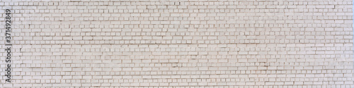 panoramic shot of large white brick wall with copy space