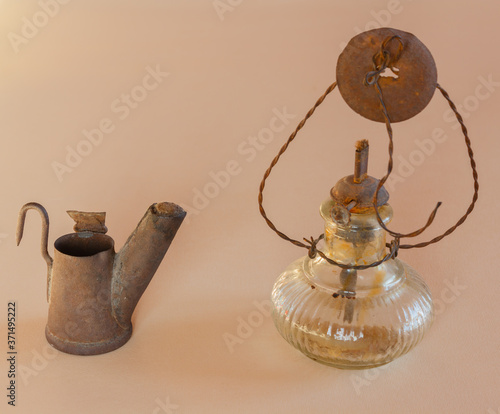 a light and a lamp old / close-up of an ancient light to work at the mine and an antique lamp to work in the fields