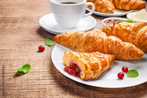 Delicious breakfast with fresh croissants