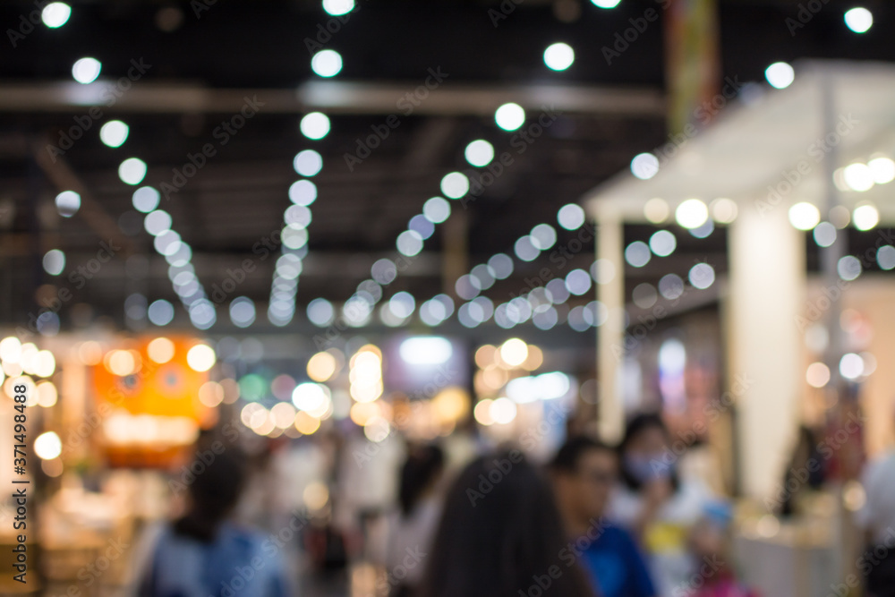 Fototapeta premium Abstract people walking in exhibition blurred background