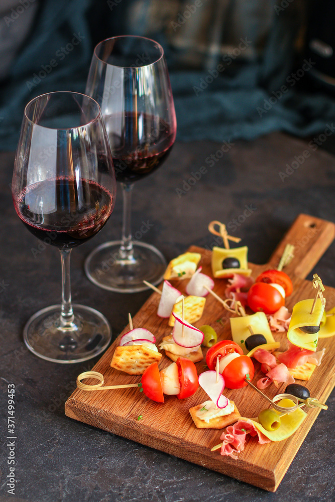 glass of wine and a snack canapes cheese plate serving size natural product portion top view place for text copy space