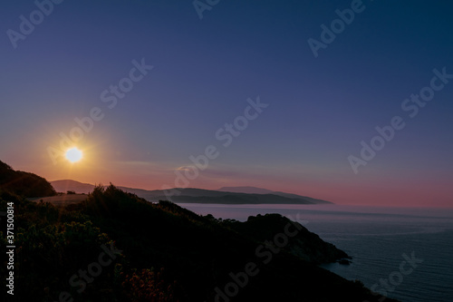 beautiful sunset over the Mediterranean sea om the cost of Greece