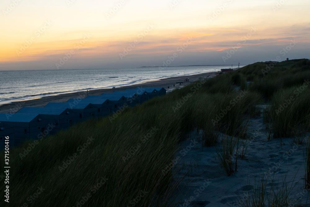 Beach houses in the netherlands in sunrise