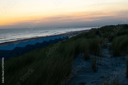 Beach houses in the netherlands in sunrise