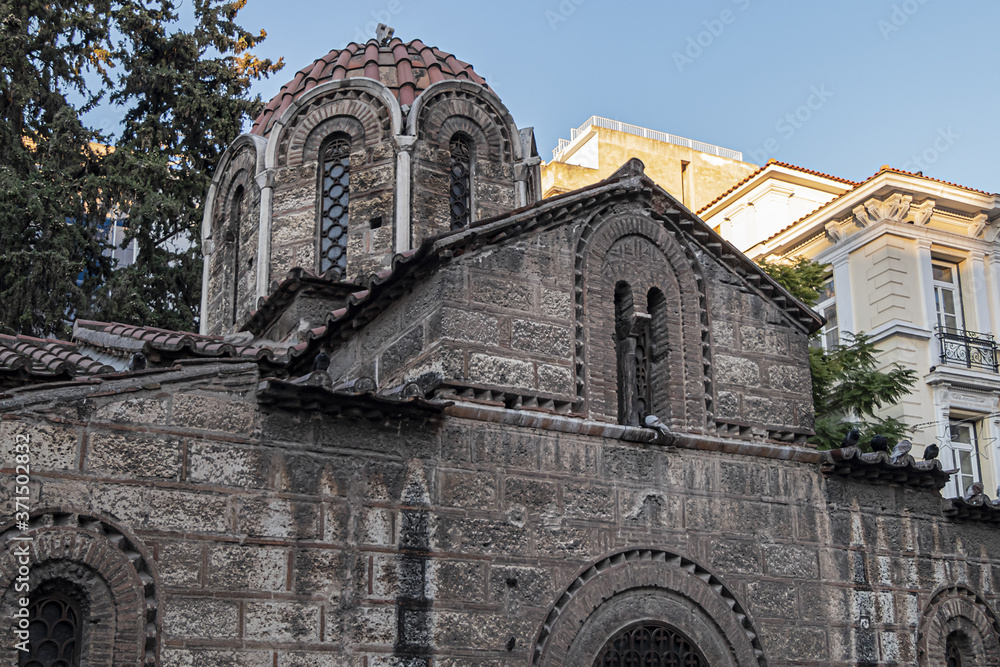 Small Byzantine style church in center of Athens known as Kapnikarea (around 1050) dedicated to Assumption of Virgin Mary, located at busy Ermou Street. Athens. Greece.