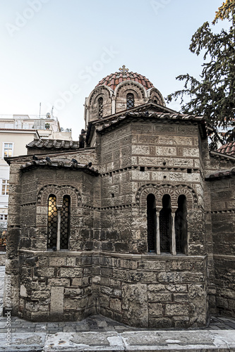 Small Byzantine style church in center of Athens known as Kapnikarea (around 1050) dedicated to Assumption of Virgin Mary, located at busy Ermou Street. Athens. Greece. photo