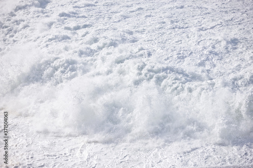 Foamy stong waves crashing in the ocean