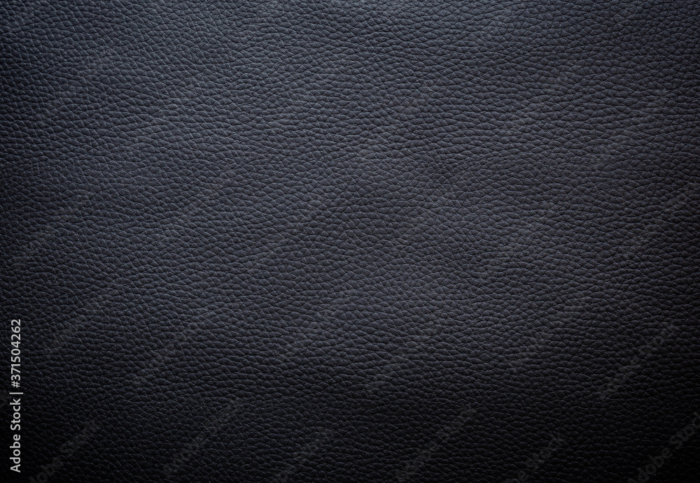 Close-up of detailed dark gray or black faux leather surface. High resolution full frame textured background. Close-up of detailed dark gray or black faux leather surface. High resolution full frame textured background.