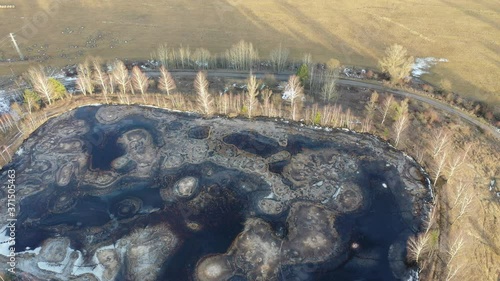 Descending flight to half frozen gudron toxic waste pit photo