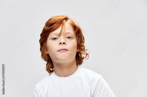 Cute child in white t-shirt cropped view lifestyle 