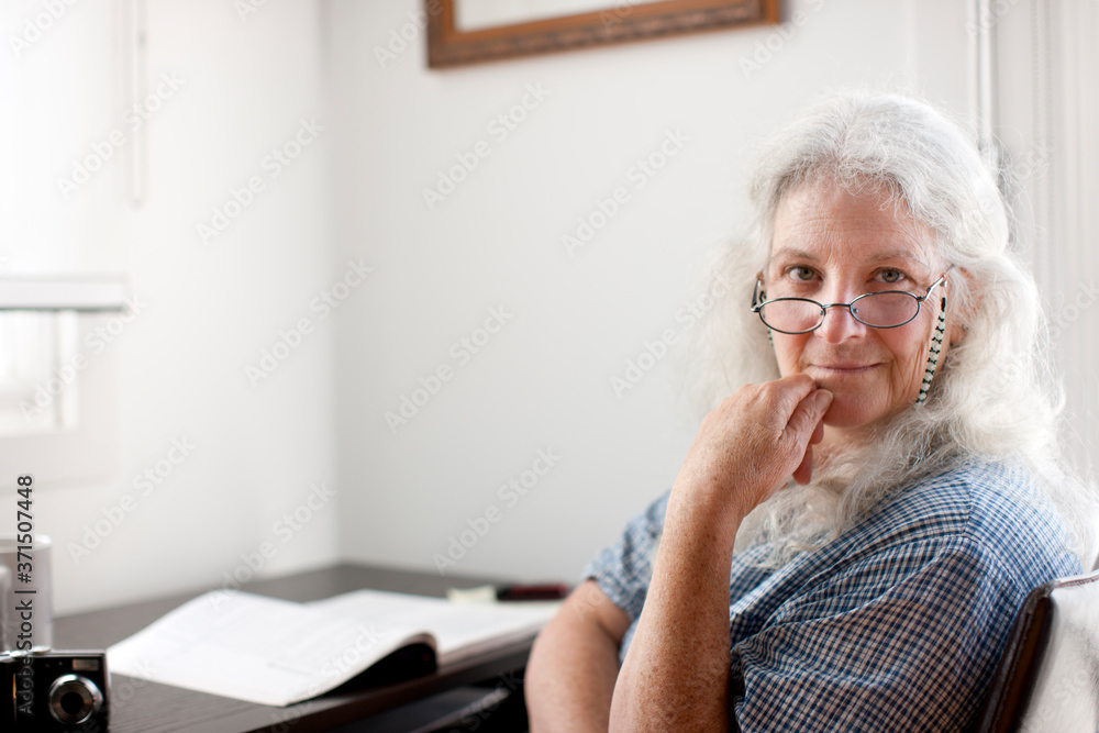 Caucasian woman sitting desk Caucasian woman sitting desk