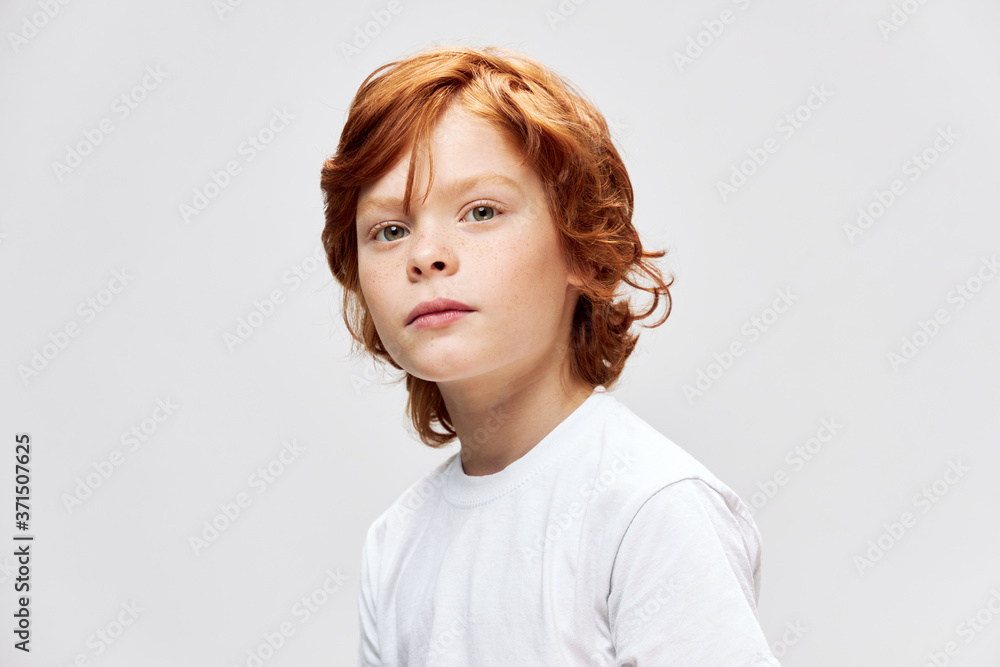 cute redhead child white t-shirt studio cropped view cute redhead child white t-shirt studio cropped view