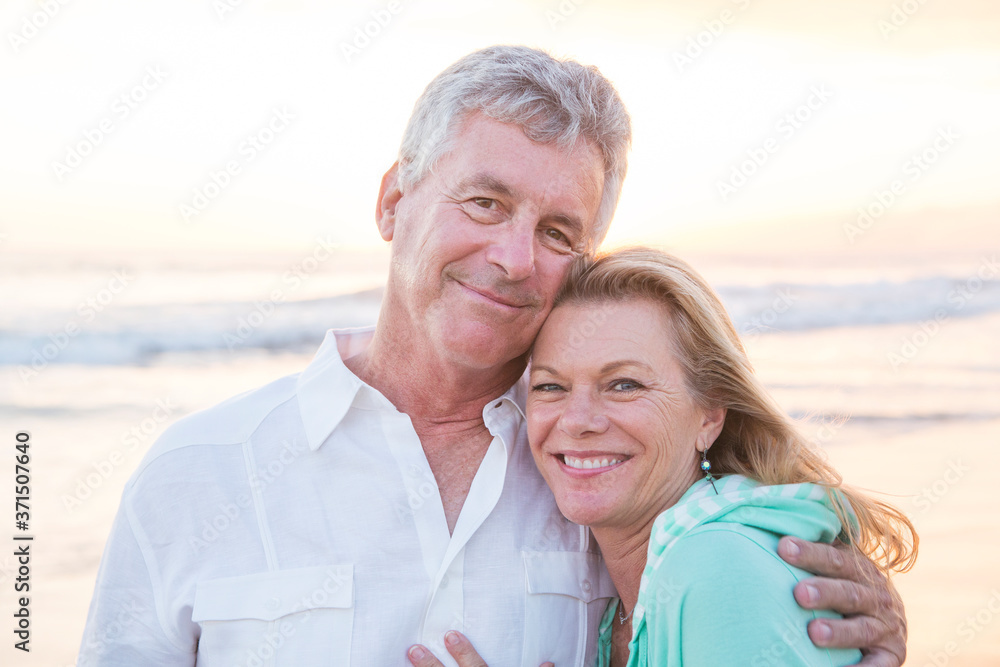 Caucasian couple hugging on beach Caucasian couple hugging on beach