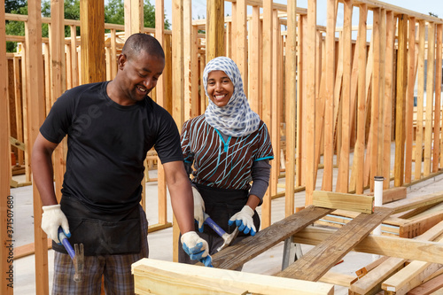 Black volunteers building house photo