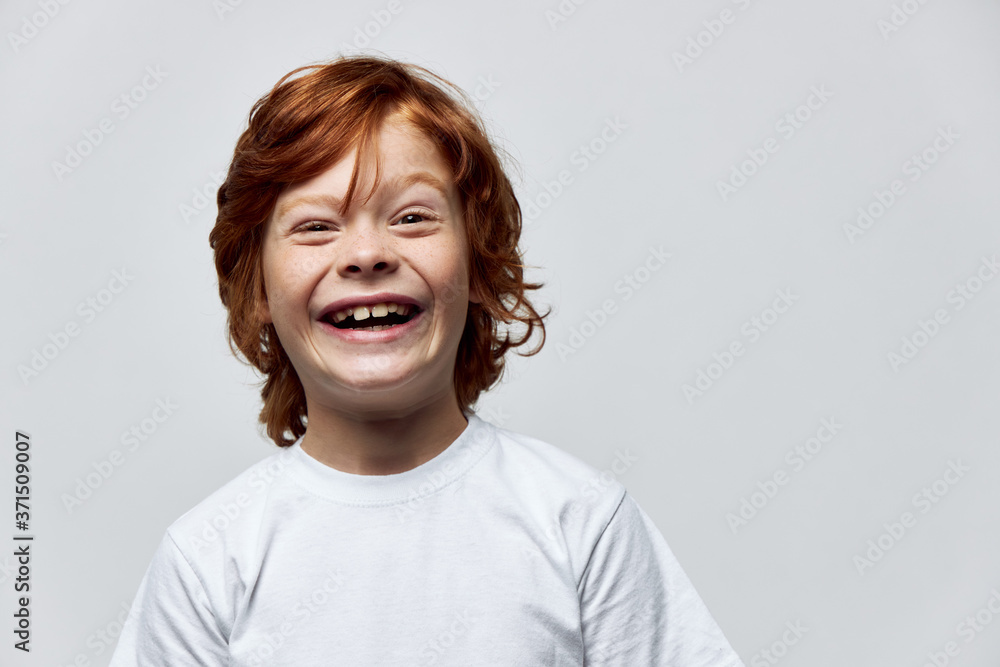 ginger child wide smile cropped view white t-shirt studio ginger child wide smile cropped view white t-shirt studio