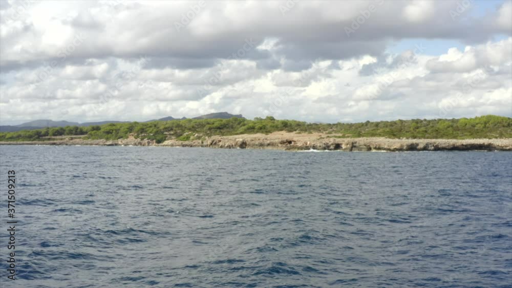 AERIAL: Tropical Island Rock Coast with Jungle Forest in the background Sunny Weather, Sunshine AERIAL: Tropical Island Rock Coast with Jungle Forest in the background Sunny Weather, Sunshine